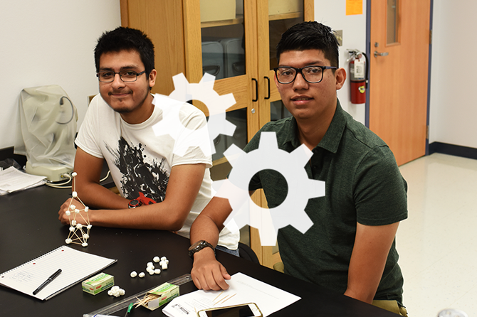 White gears logo over a photo of two students working on a science project in a lab classroom